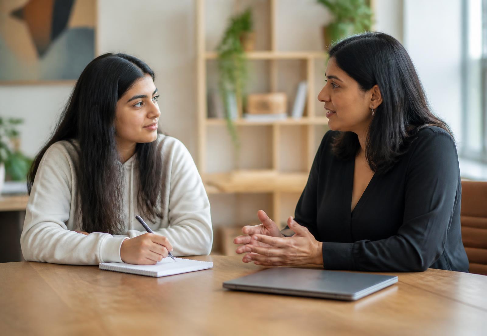 A student discussing her study plans with an adviser